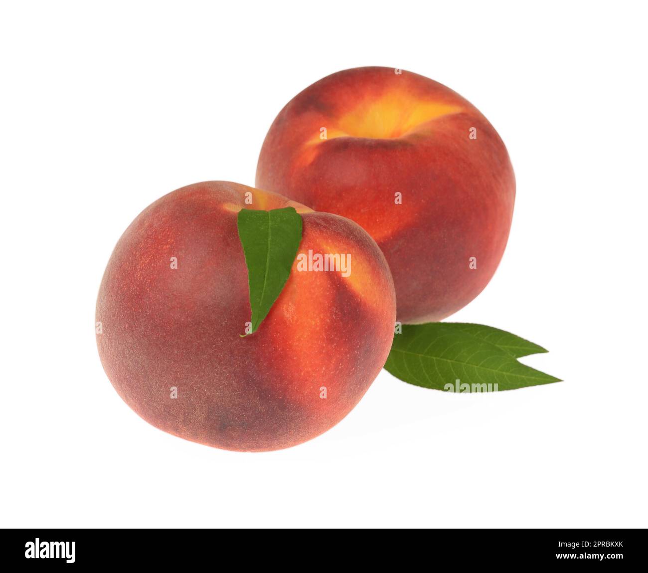 Delicious fresh ripe peaches with green leaves isolated on white Stock ...