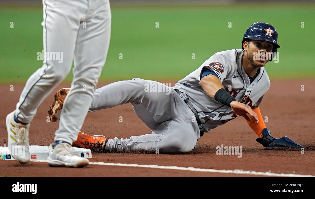 Houston Astros' Jeremy Pena slides into third base on a wild pitch by Tampa  Bay Rays' Calvin Faucher during the first inning of a baseball game  Wednesday, April 26, 2023, in St.