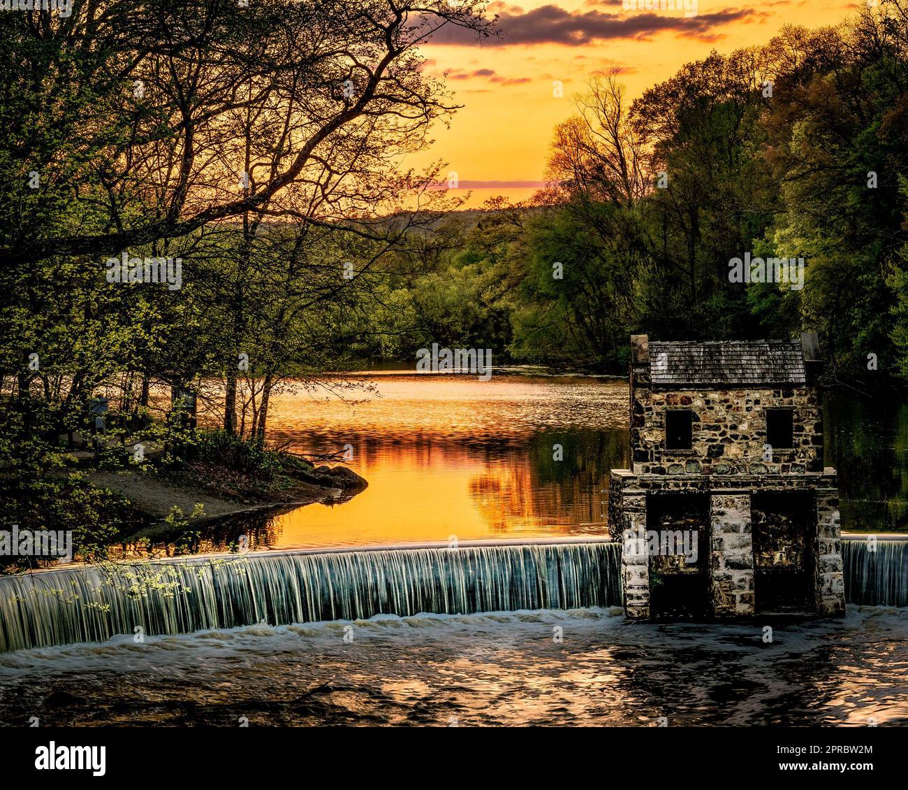 Morristown, NJ - USA - April 23, 2023 Landscape view of historic Speedwell Dam and Lake at sunset. Stock Photo