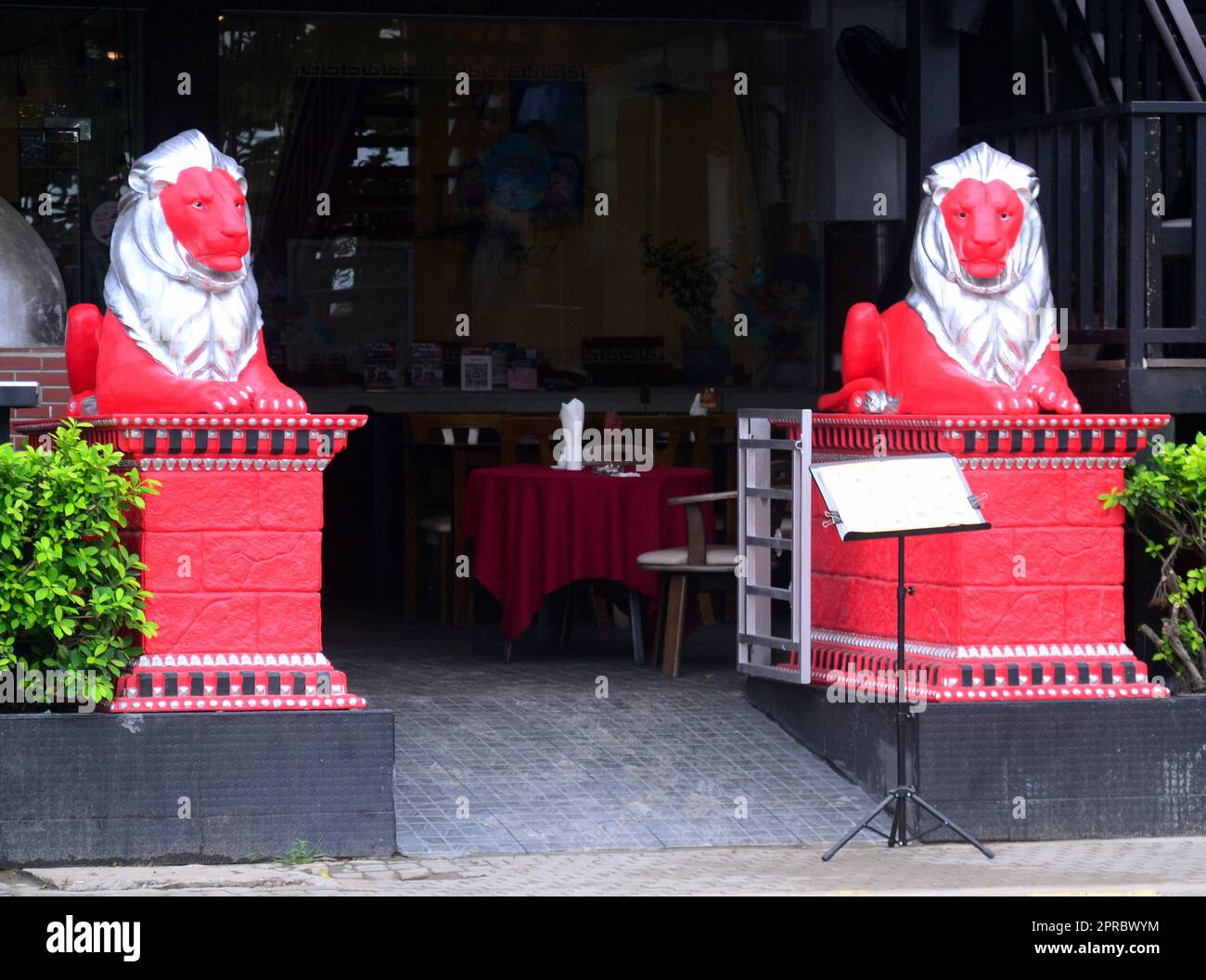 Two lion statues guard the entrance to an eatery in Jomtien, Pattaya