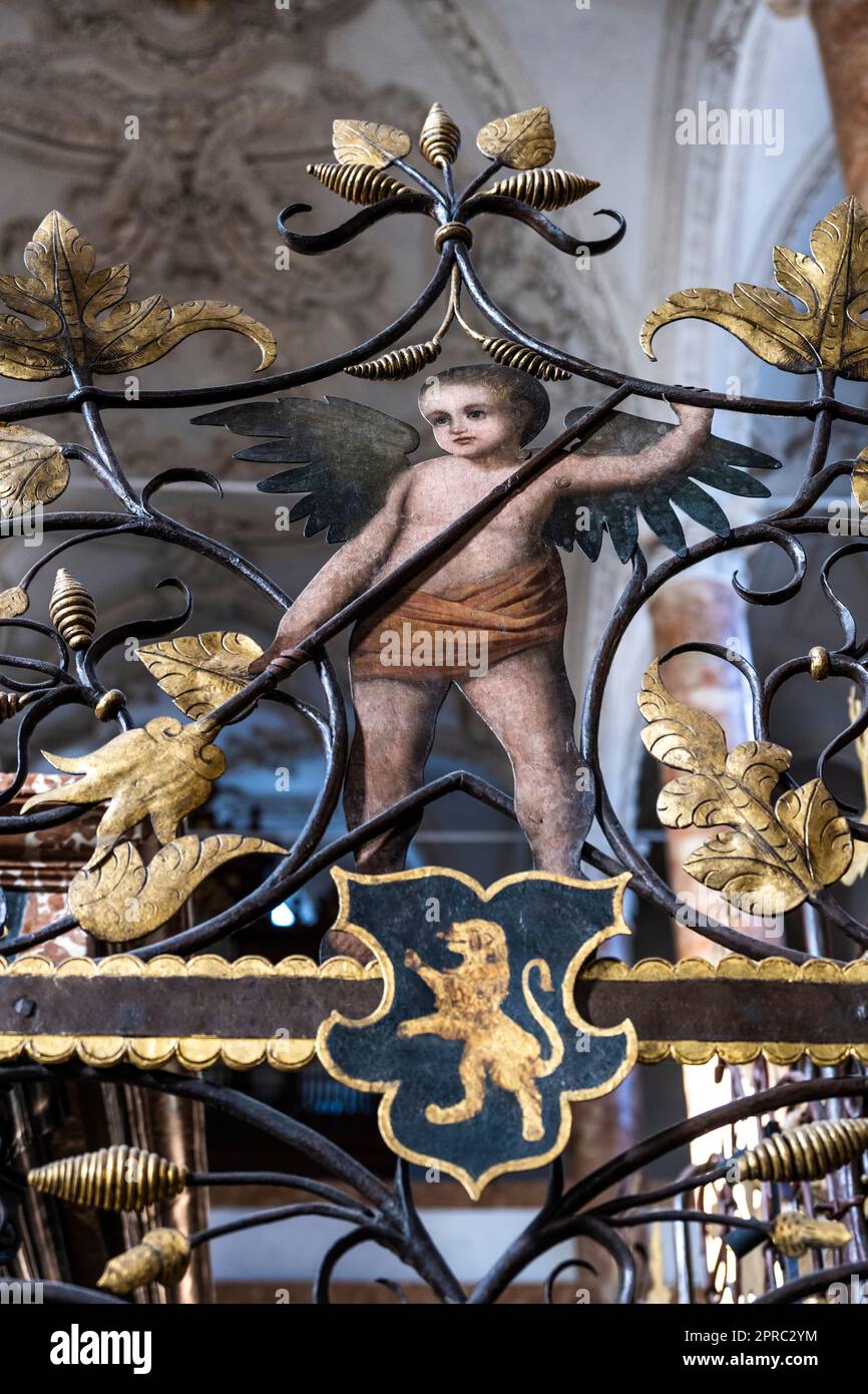 angel and standing lion on the wrought-iron panel of the cenotaph of Maximilian I at the Hofkirche in Innsbruck Austria Stock Photo