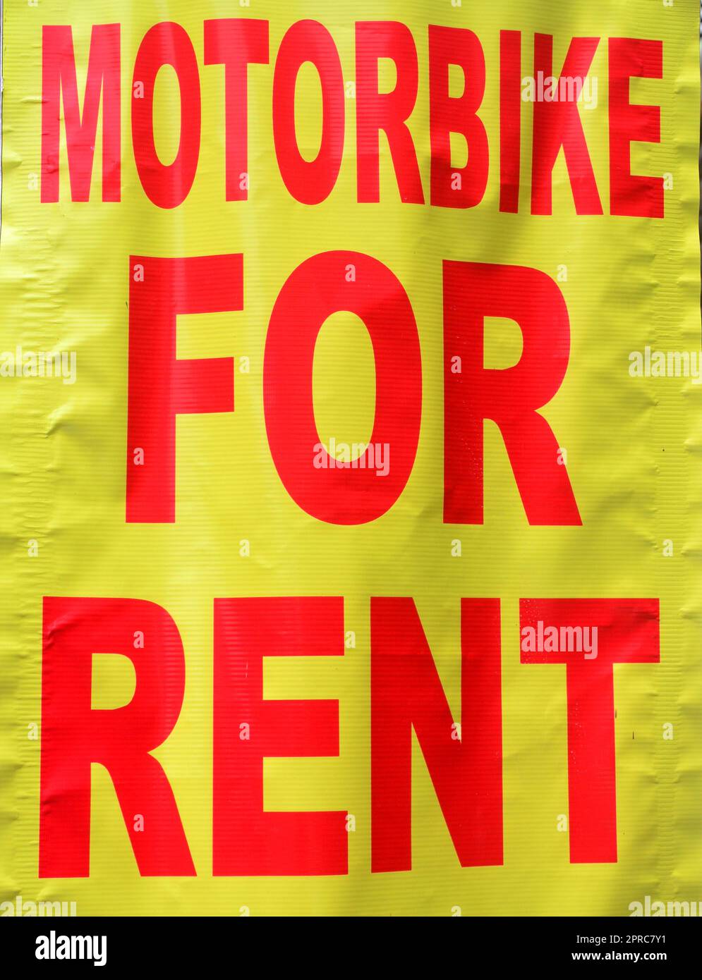 Sign on banner: 'Motorbike for Rent'. Stock Photo