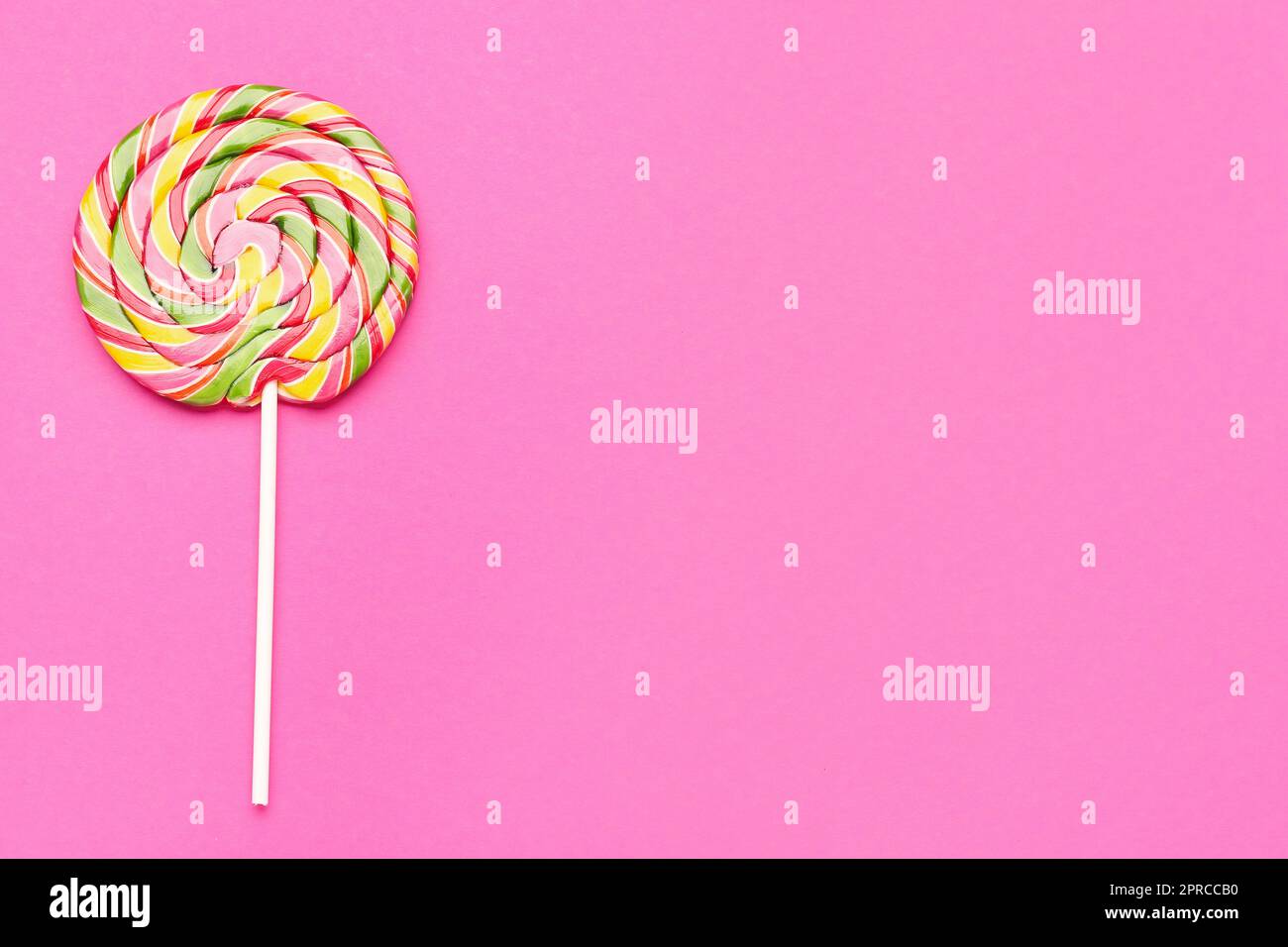 Colorful lollipop on pink background Stock Photo - Alamy