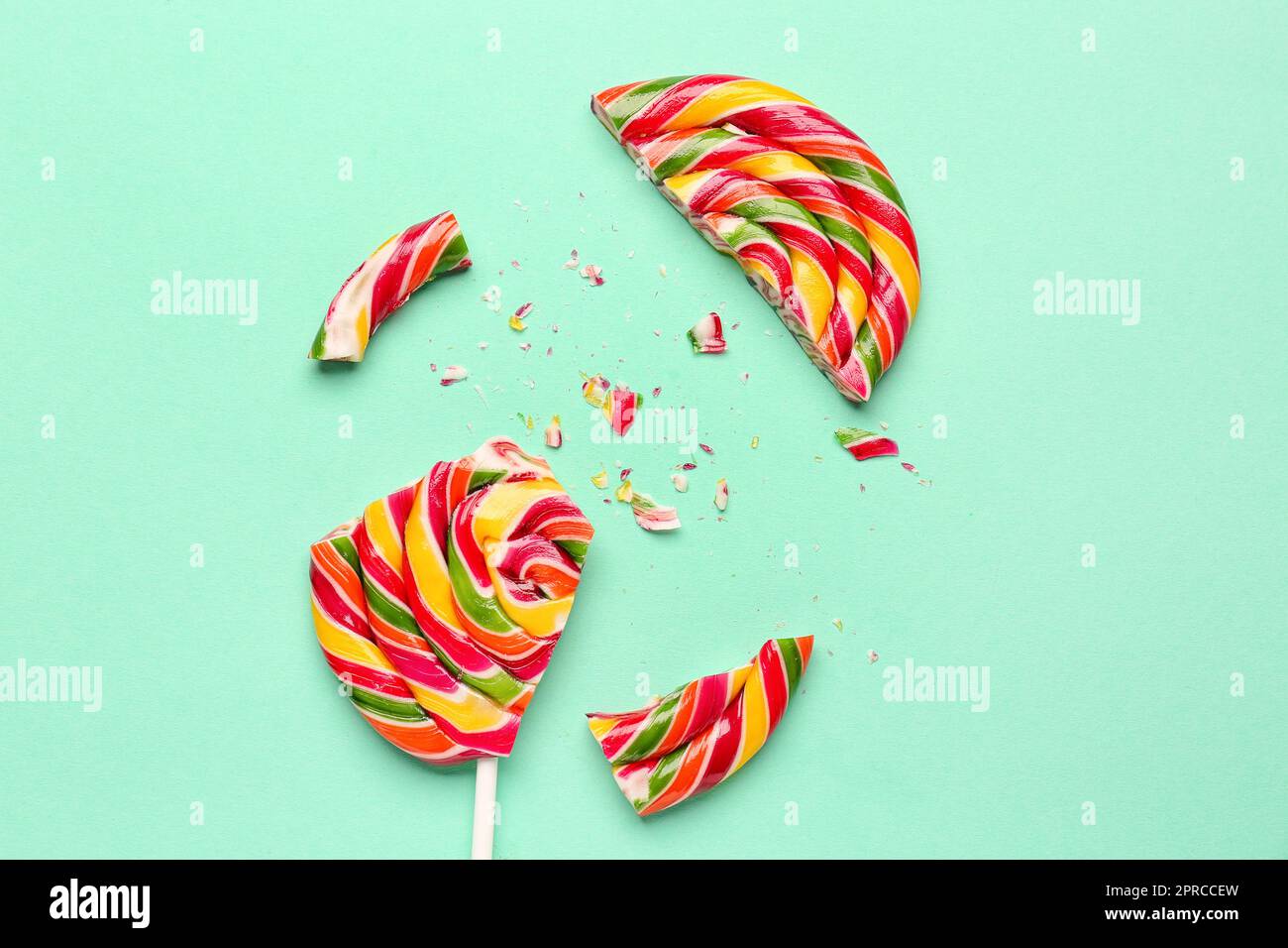 Crushed colorful lollipop on turquoise background Stock Photo Alamy