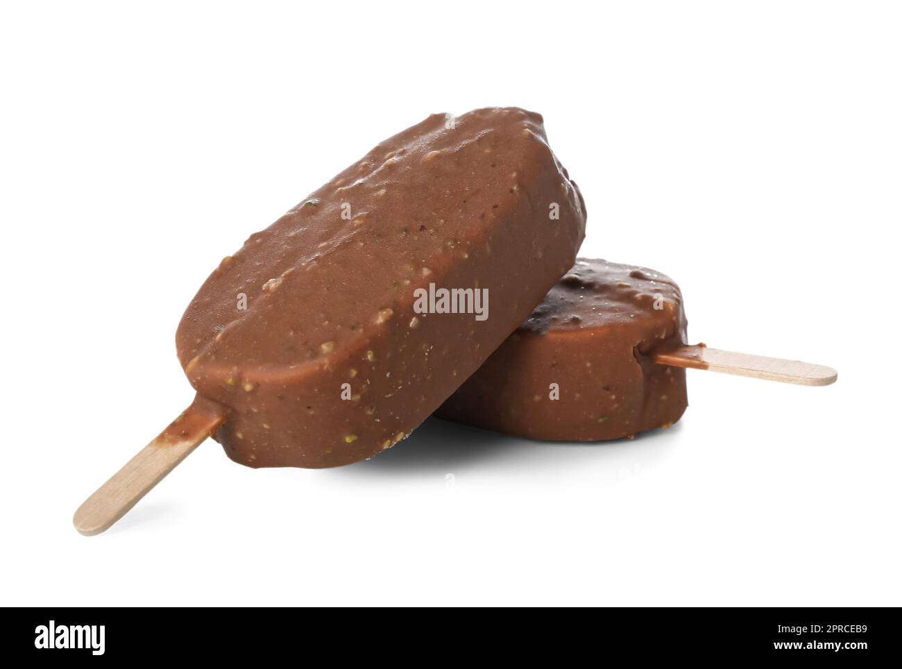 Delicious chocolate covered ice cream on stick against white background