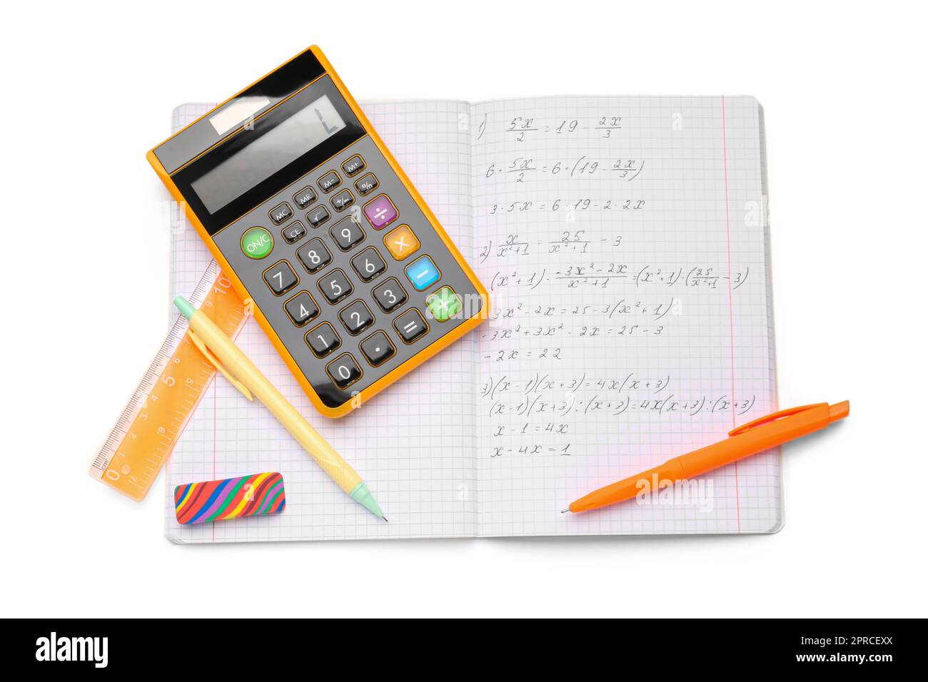 Copybook with maths formulas, calculator and stationery isolated on