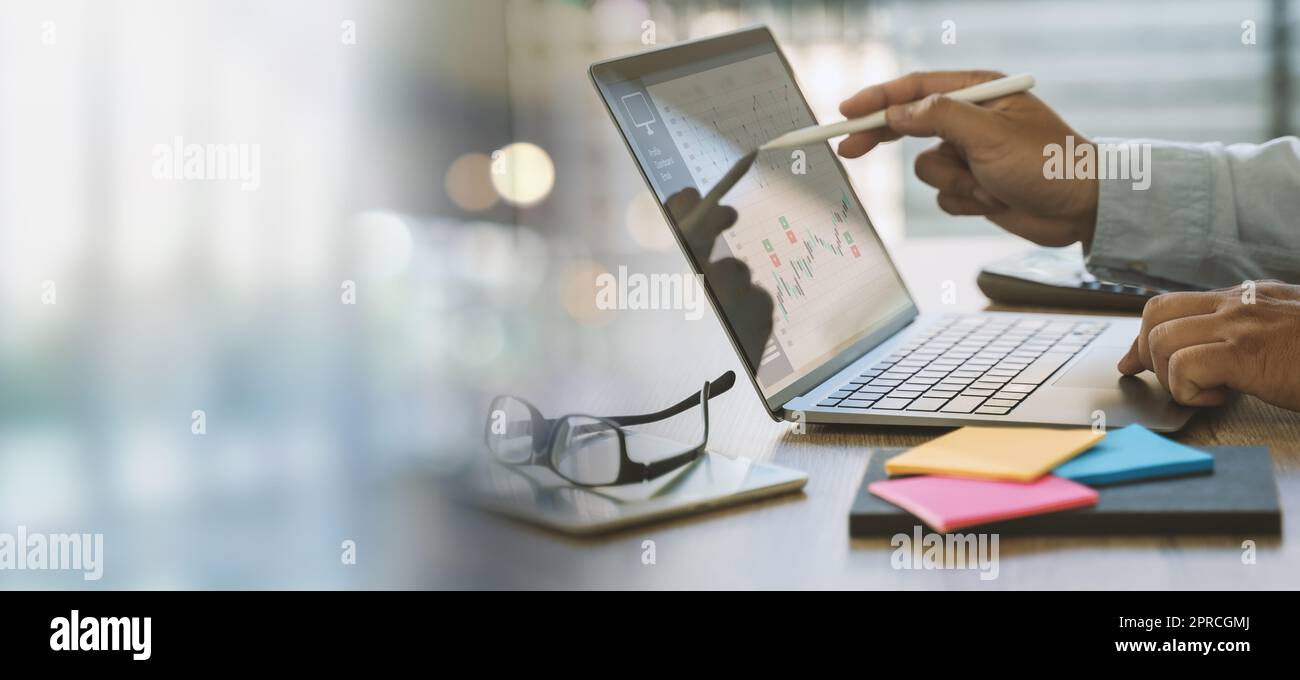 Business data dashboard analysis by a man using computer graphs on a virtual screen Business strategy Stock Photo