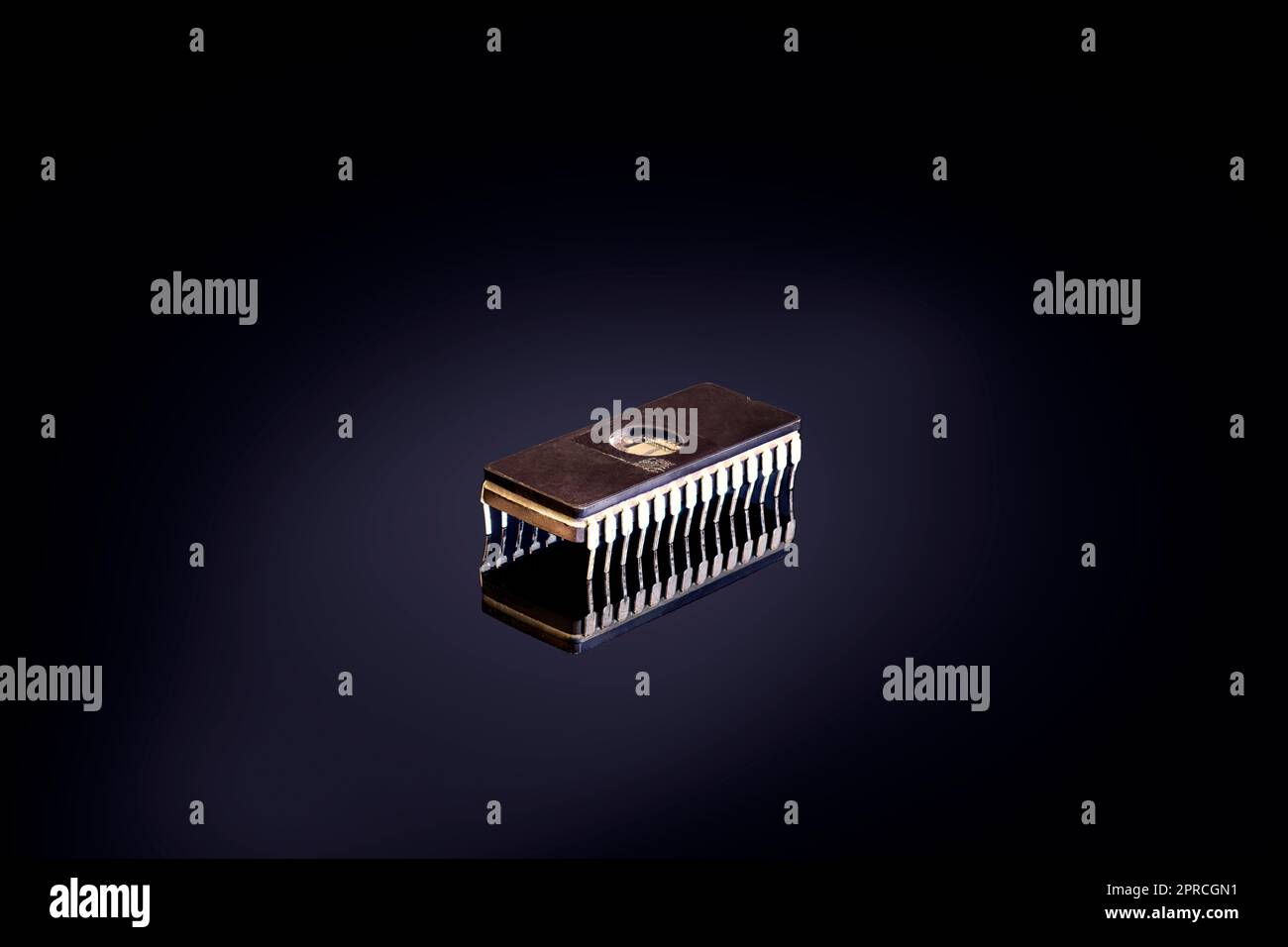 one single Integrated circuit isolated on black background Stock Photo