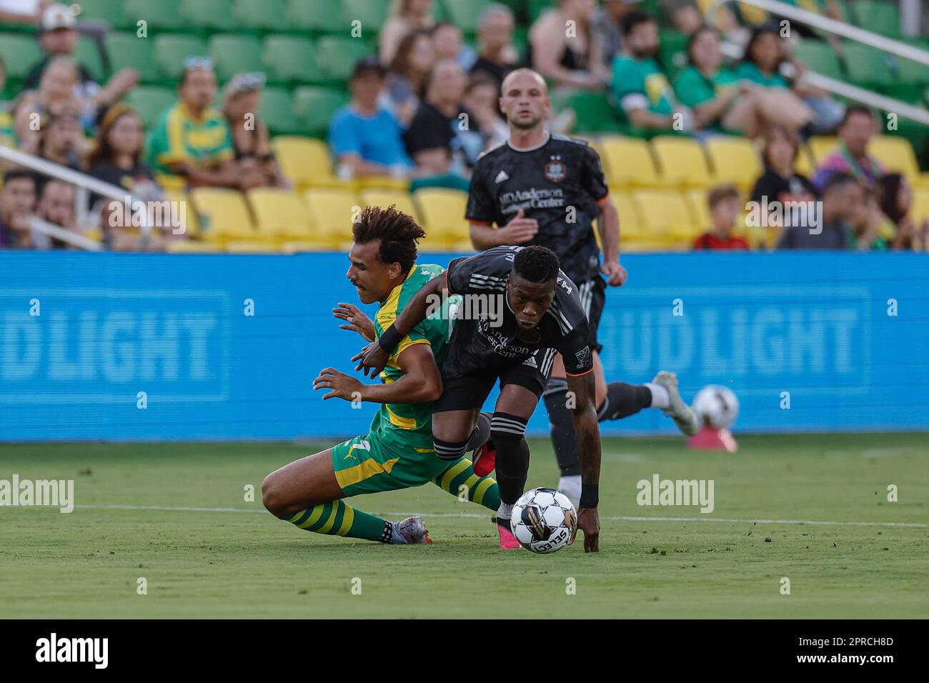 St. Petersburg, FL: Tampa Bay Rowdies forward JJ Williams (9) and Houston Dynamo defender Teenage Hadebe (17) fight for possession of the ball during Stock Photo