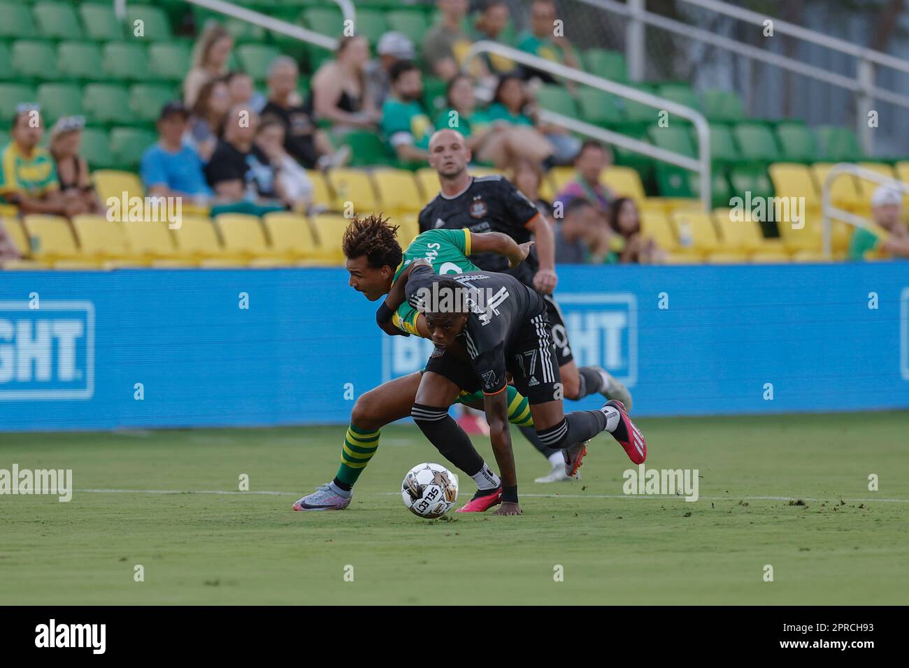 St. Petersburg, FL: Tampa Bay Rowdies forward JJ Williams (9) and Houston Dynamo defender Teenage Hadebe (17) fight for possession of the ball during Stock Photo