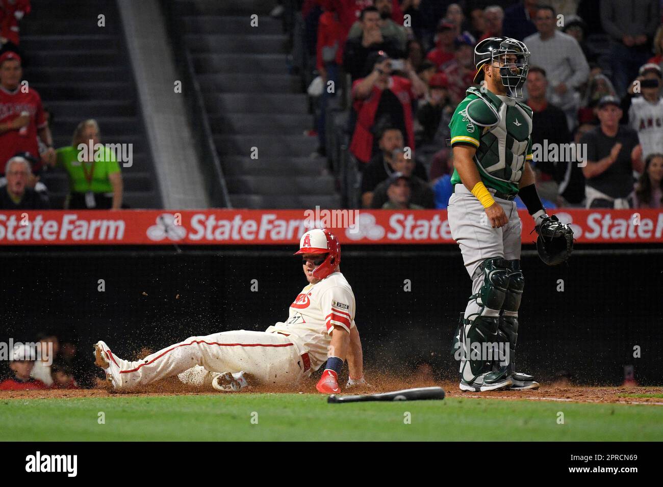 Los Angeles Angels' Mike Trout, left, scores on a single by Shohei