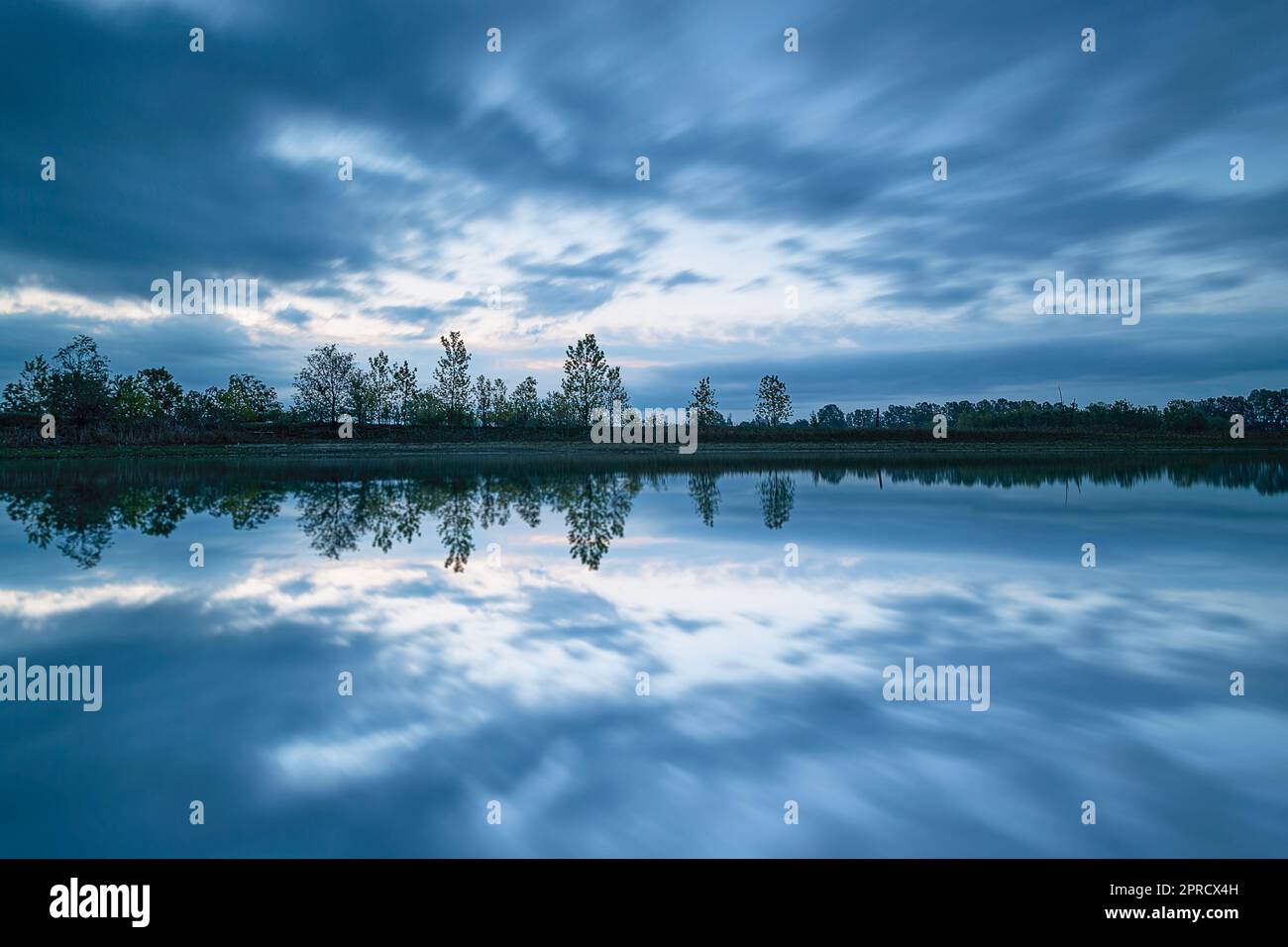 At dusk, reflection lake with clouds Stock Photo