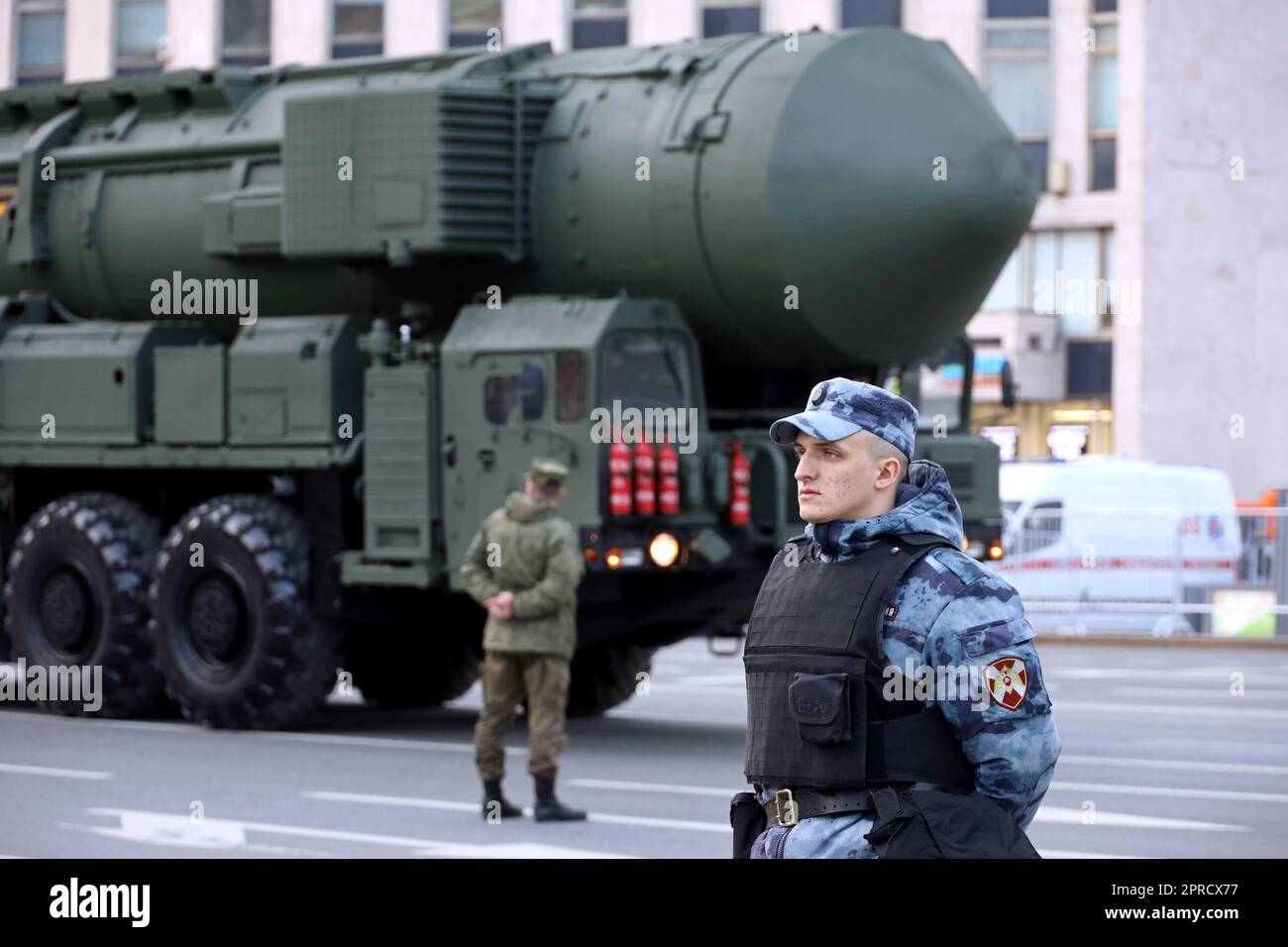 Nuclear weapon, soldiers of russian military forces standing on background of strategic missile system 'Yars' on city street Stock Photo