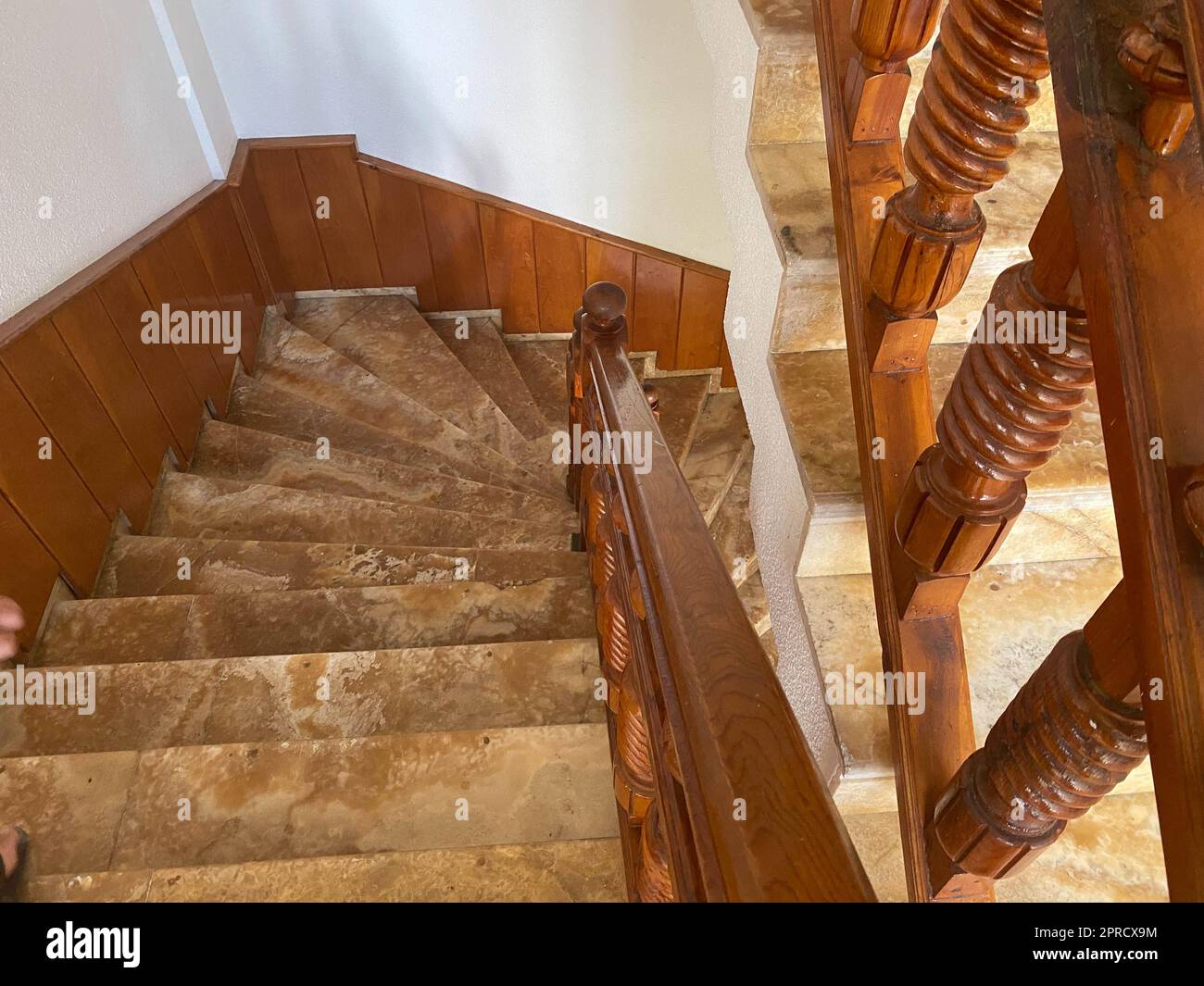 Beautiful stone staircase with steps and wooden railings Stock Photo ...