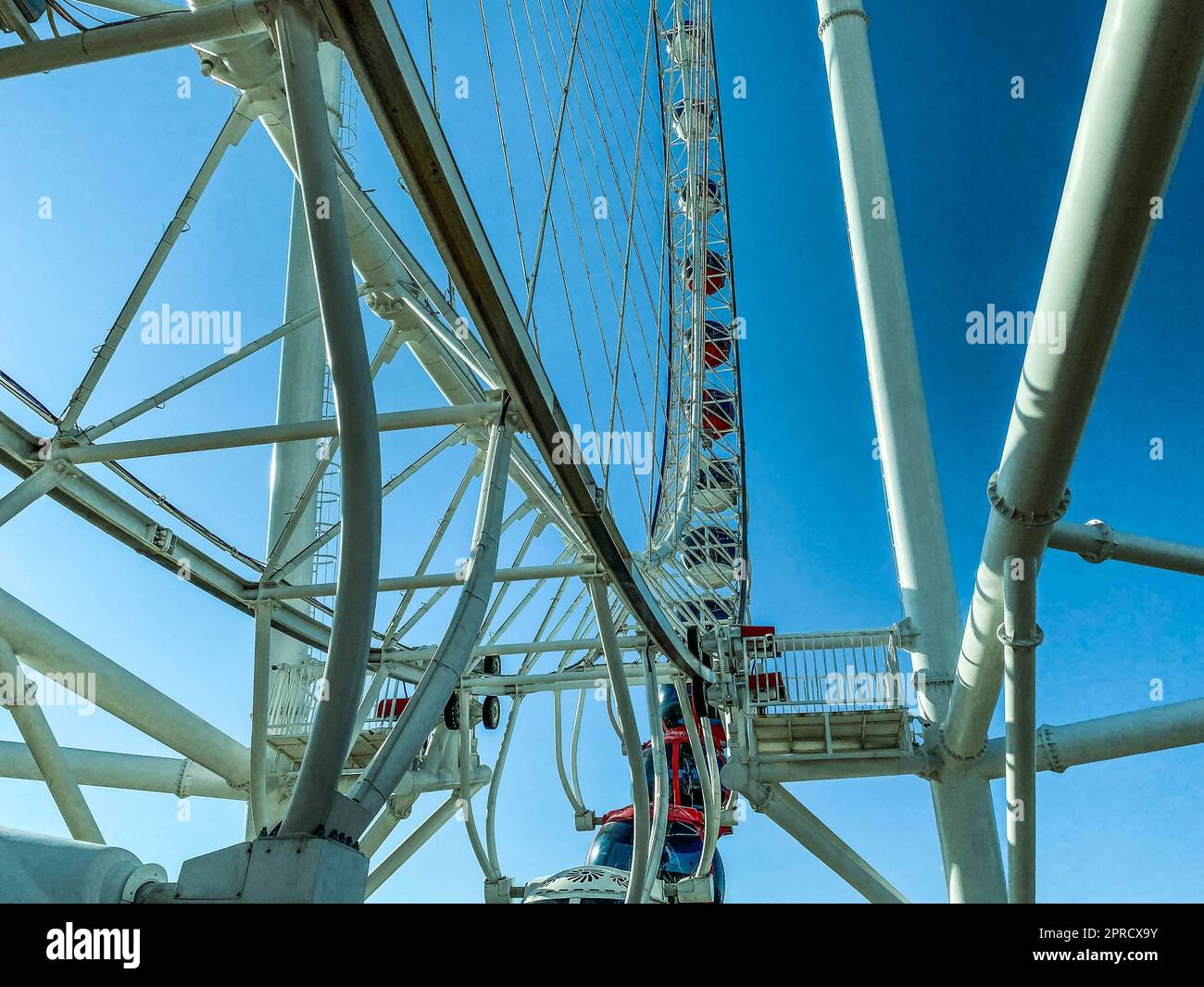 Ferris wheel in the city against the blue sky. carousel for riding