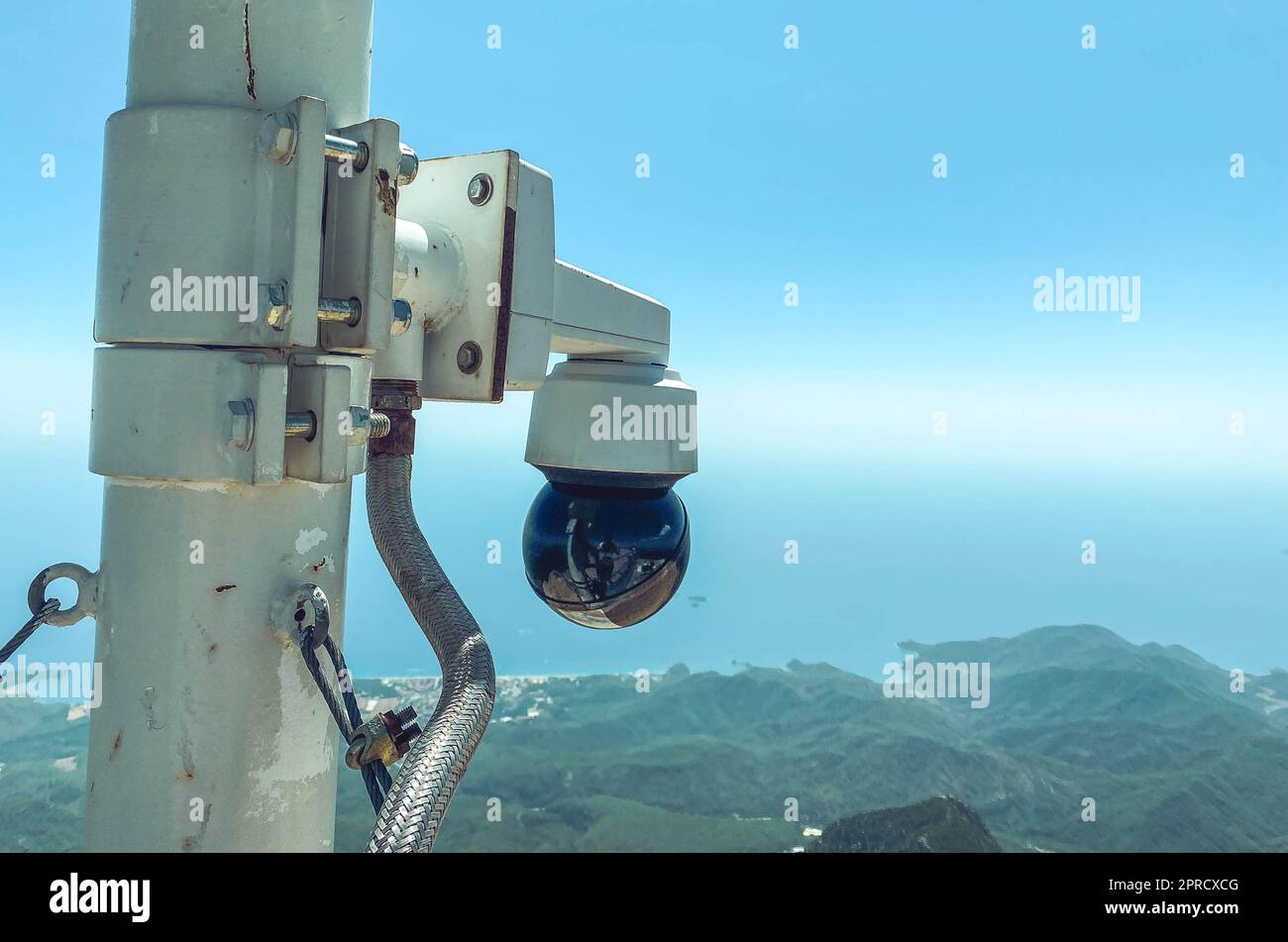 video camera on the observation platform on the mountain. small, hidden camera for recording people and tourists. keeping order in a public place. Stock Photo