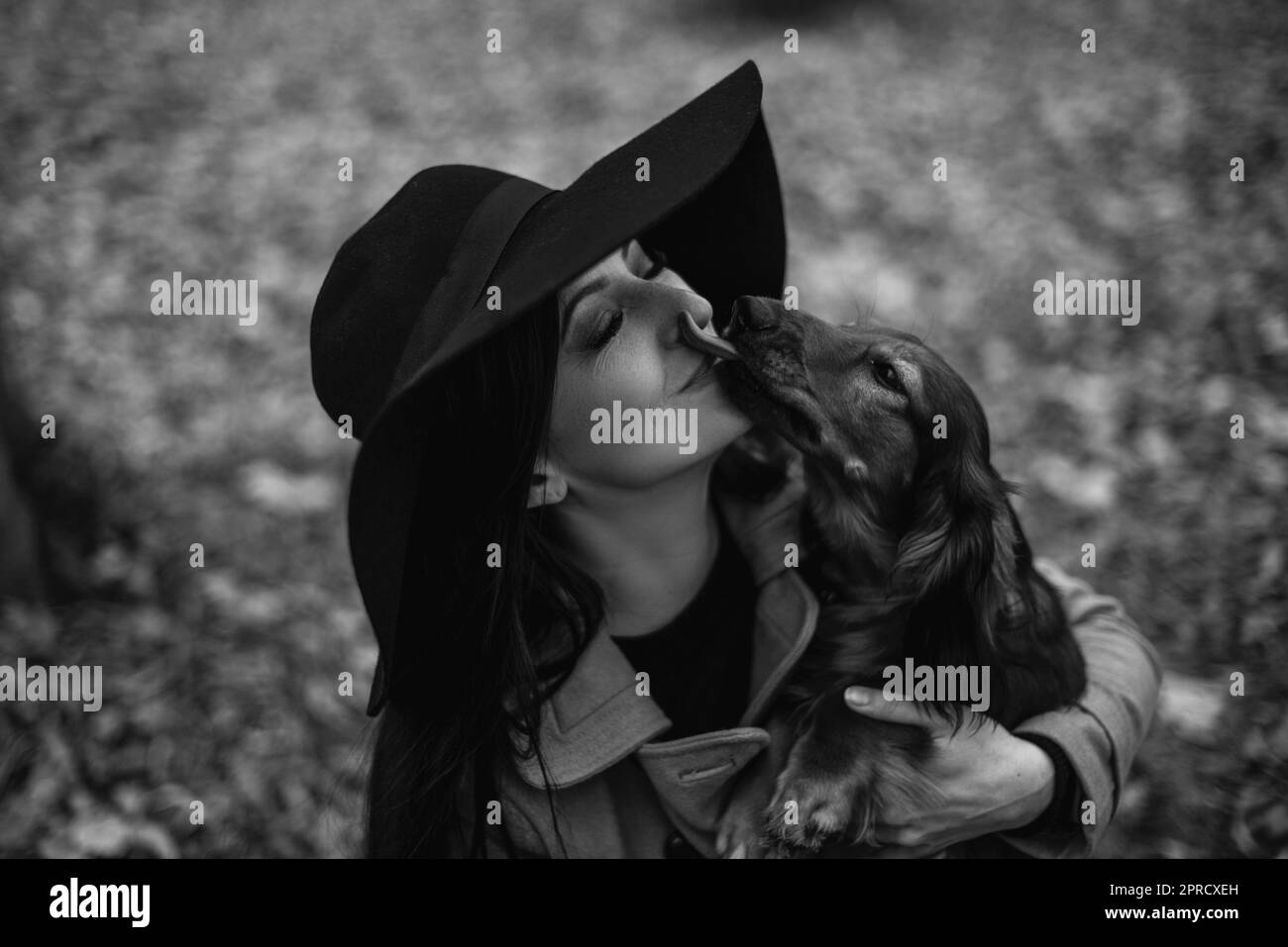 Dog licking girl Black and White Stock Photos & Images - Alamy