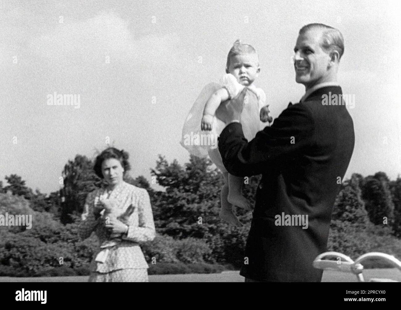 File photo dated 18/07/49 of Prince Charles being lifted up by his