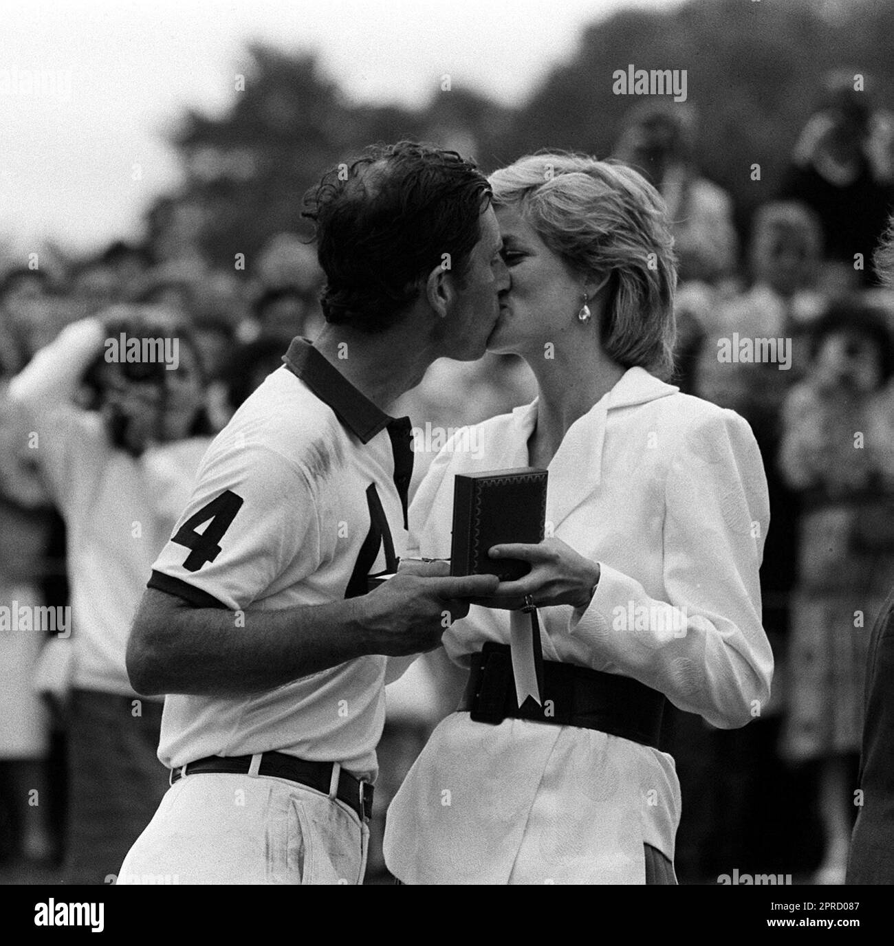 File photo dated 27/07/86 of the Princess of Wales presenting her husband, the Prince of Wales, with a prize and a kiss after he played for the England II team against Chile at the Cartier International Polo Spectacular at the Guards Polo Club in Windsor Great Park, Berkshire. Photos from every year of the King's life have been compiled by the PA news agency, to celebrate Charles III's coronation. Issue date: Thursday April 27, 2023. Stock Photo