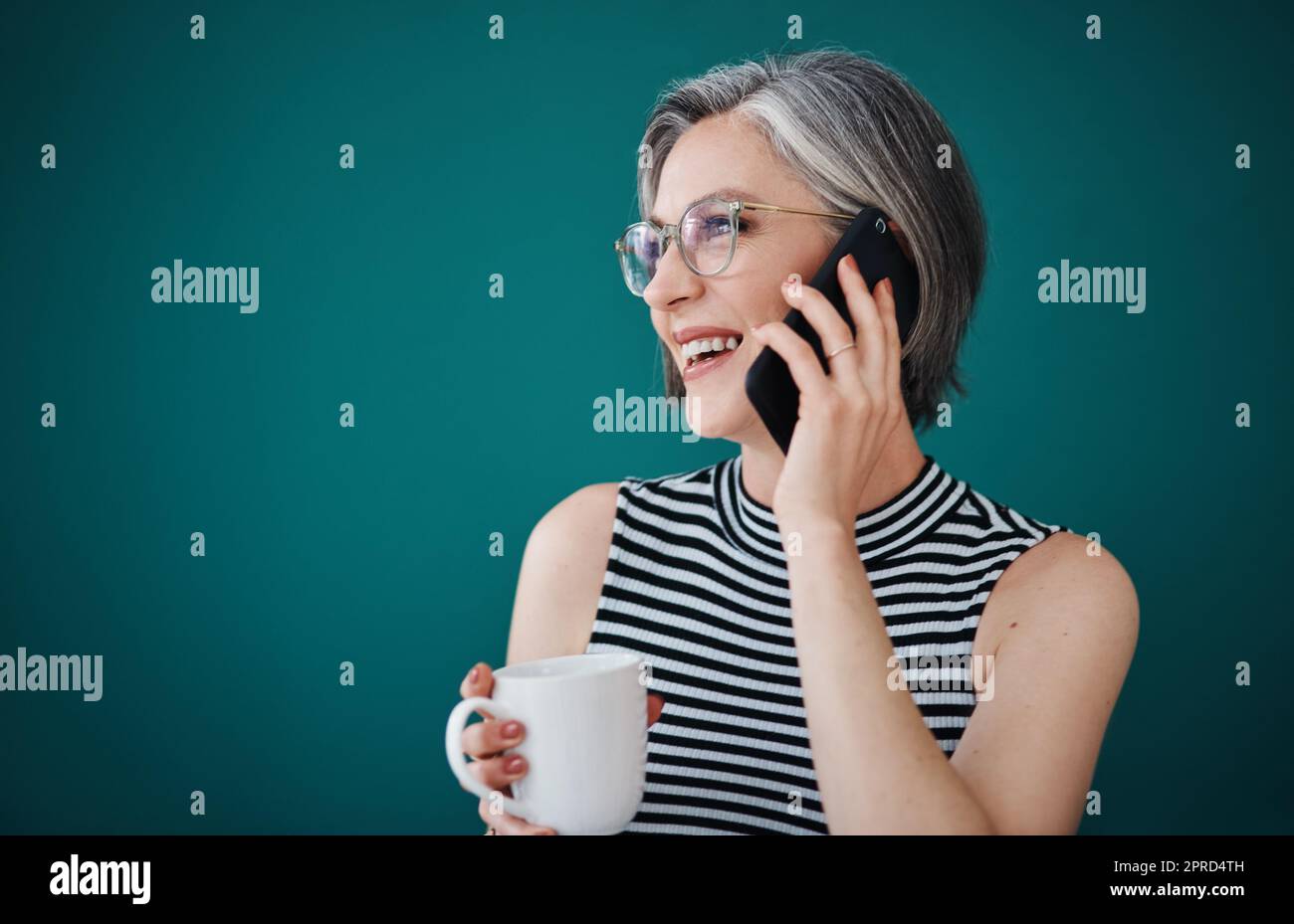 https://c8.alamy.com/comp/2PRD4TH/its-time-well-spent-to-keep-your-clients-happy-a-businesswoman-having-coffee-while-talking-on-her-cellphone-in-her-office-2PRD4TH.jpg
