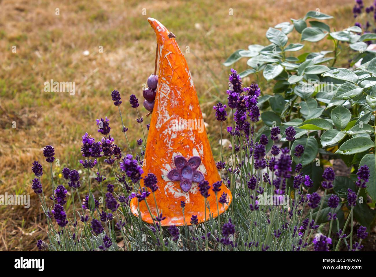 garden deco in lavender bed Stock Photo