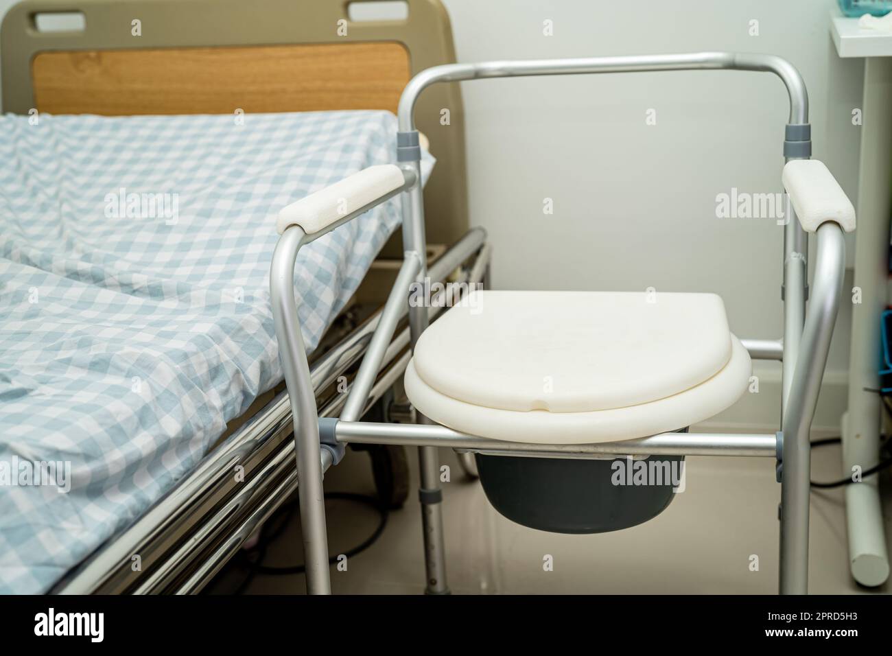 Flush toilet and shower chair in bathroom for old elder people. Stock Photo