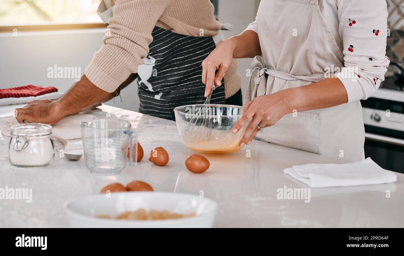 Hubby makes the best baking buddy. a couple baking together at home. Stock Photo