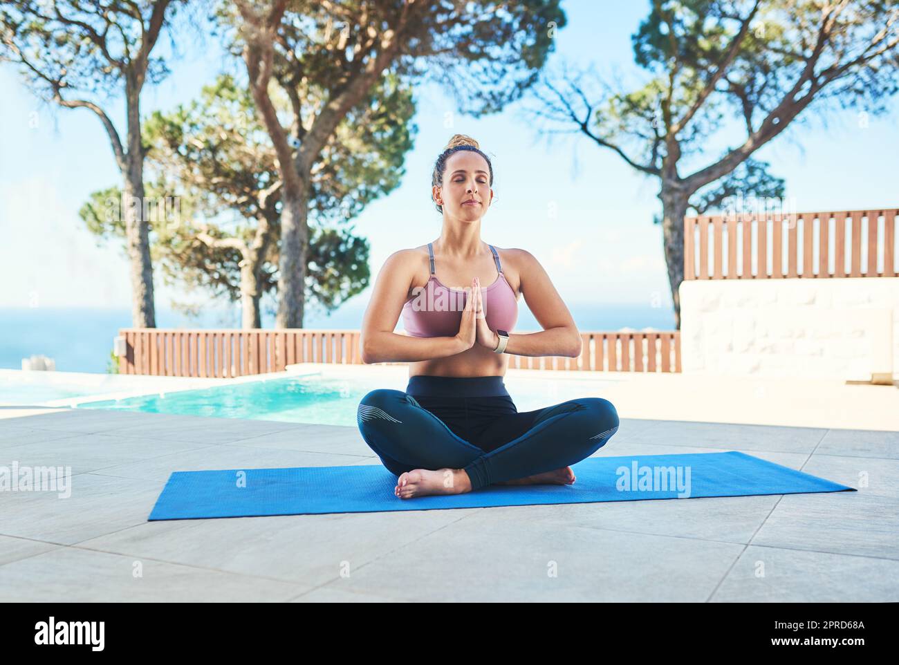 Theres no better way to deal with challenges. a young female athlete practising yoga at home. Stock Photo