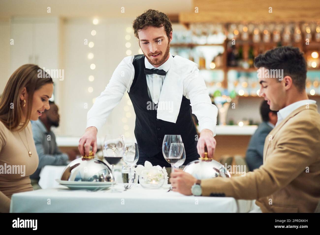 Waiter serving food restaurant hires stock photography and images Alamy