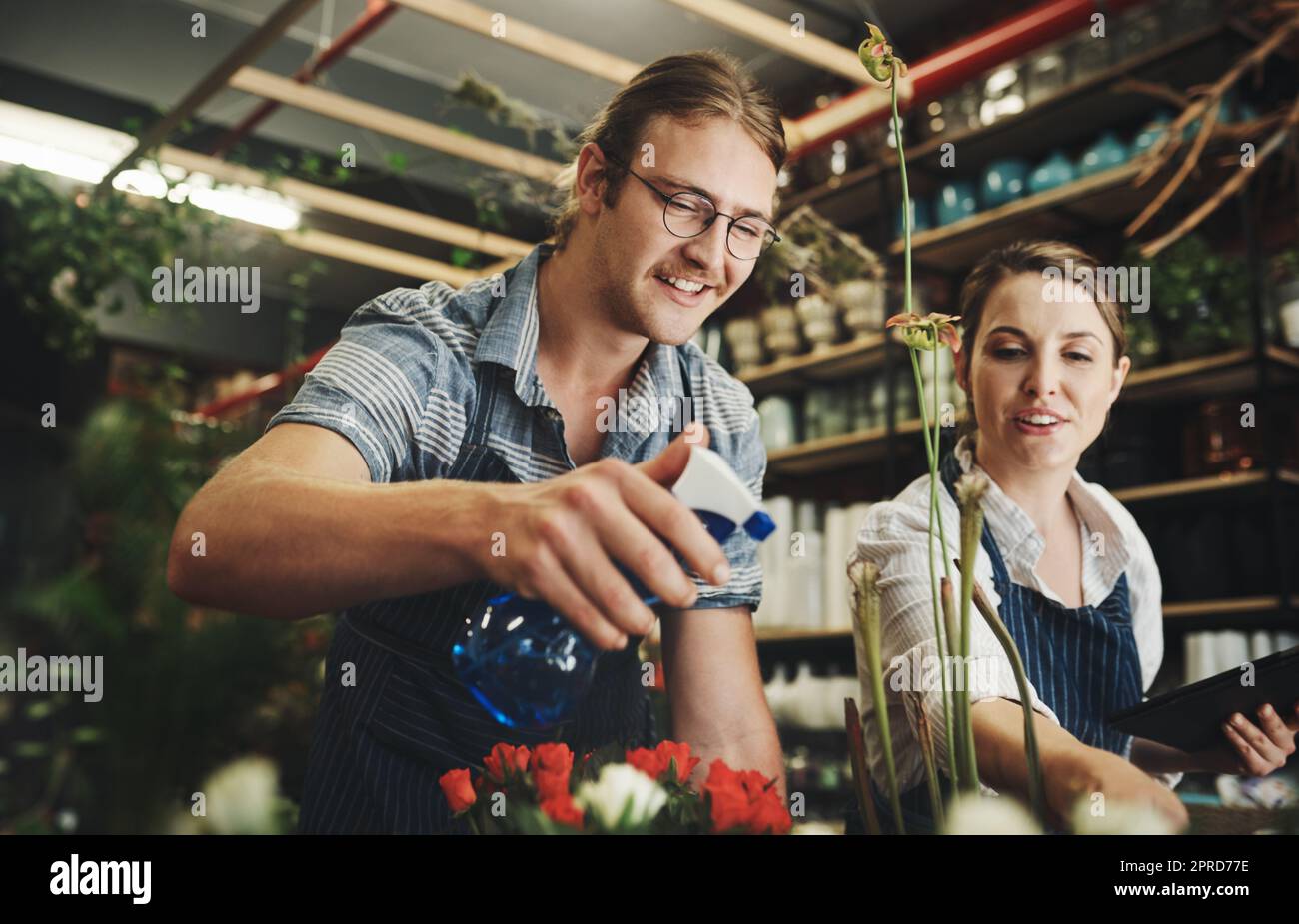 Just making sure our plants dont go thirsty. two young florists