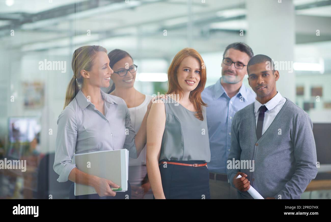 Leadership, promotion and teamwork of colleagues congratulating their manager on success or achievement. Happy and diverse workers feeling proud and happy being part of a team with a great leader Stock Photo