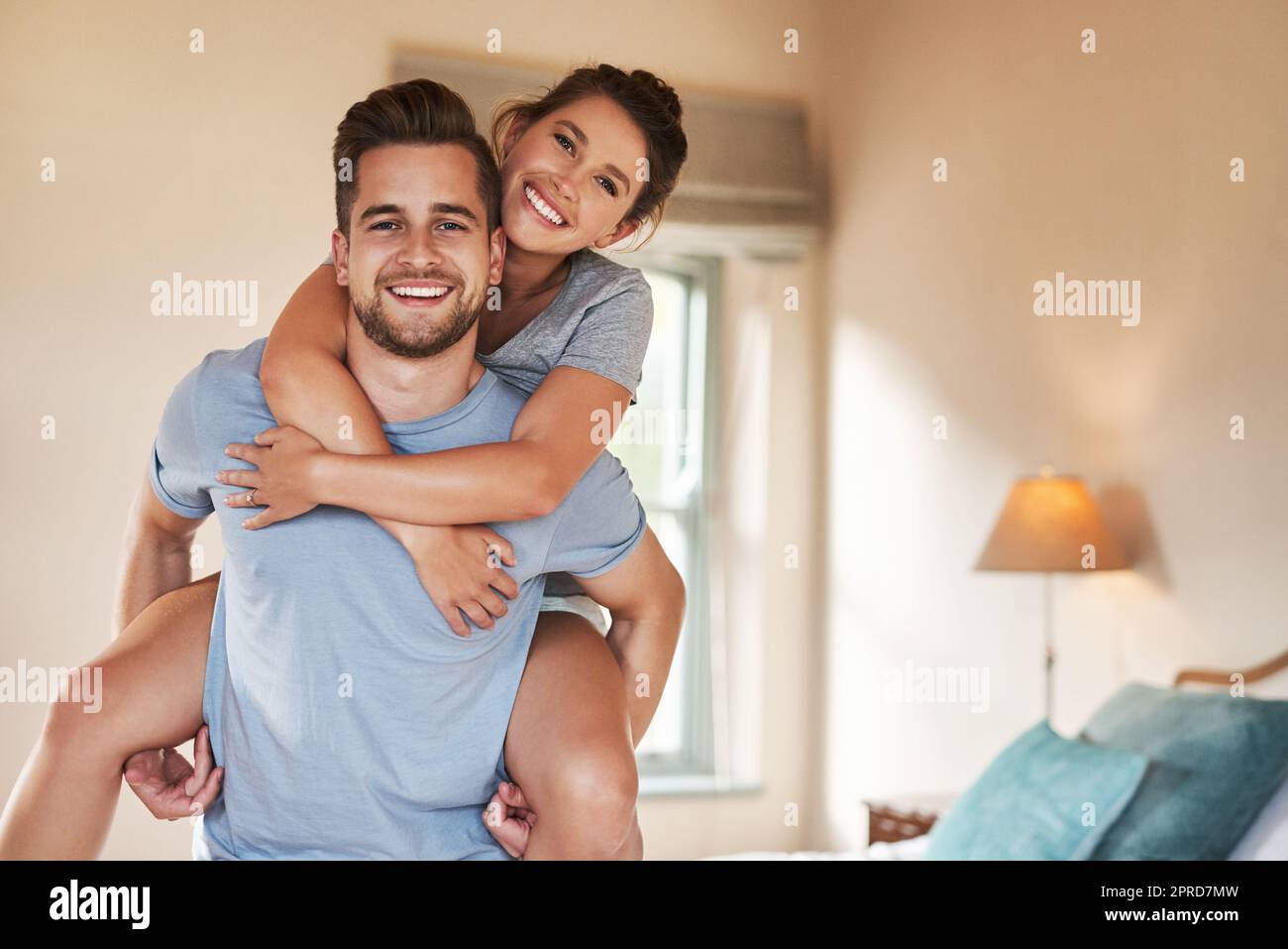Live a life full of love and happiness. Portrait of a playful young couple spending some quality time together in their bedroom. Stock Photo