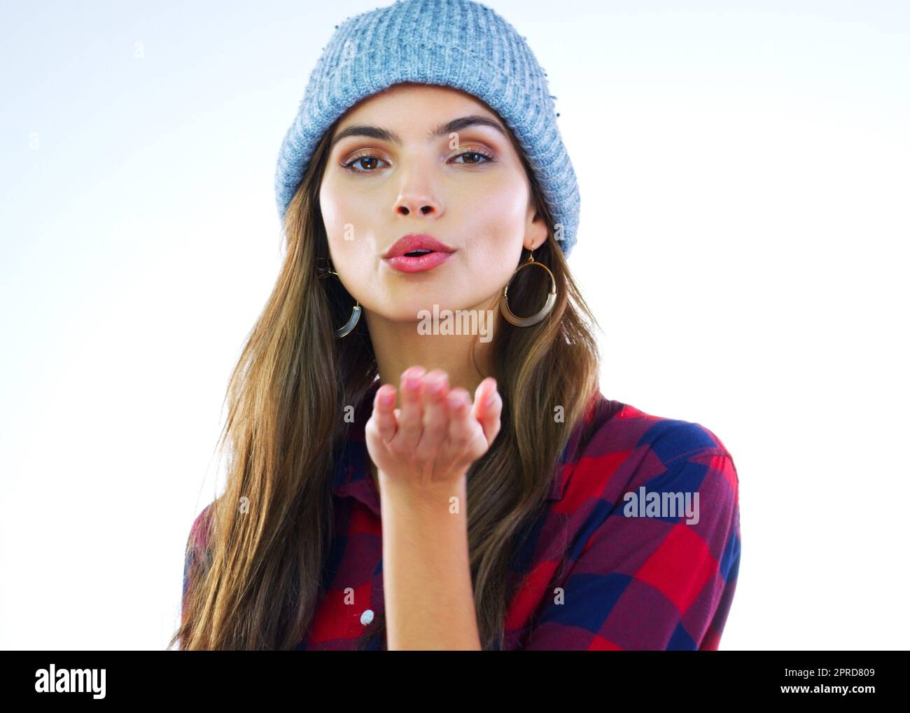 It always starts with a simple kiss. a beautiful young woman blowing