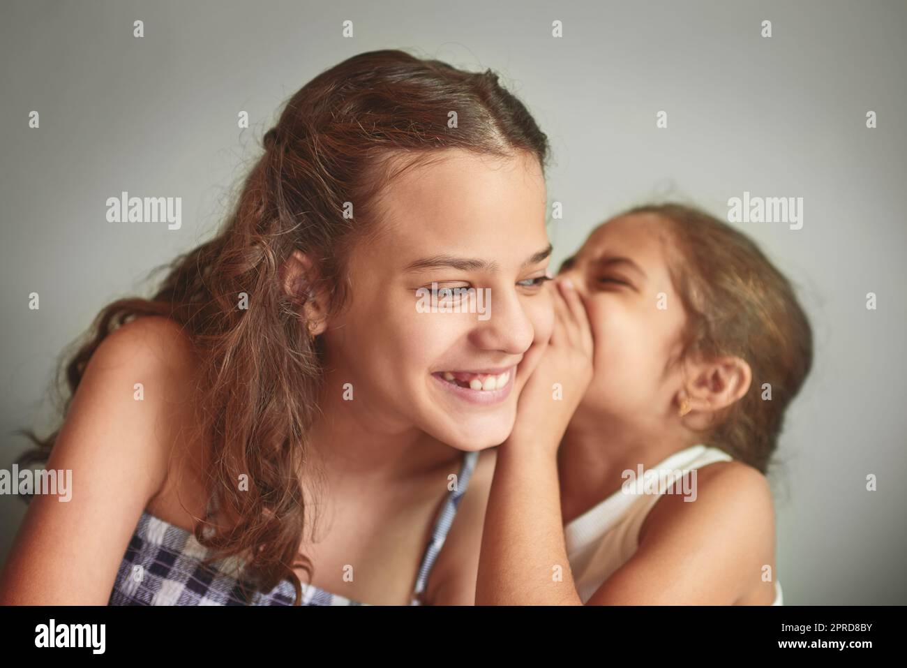 I tell her all my secrets. two young girls spending time together at home. Stock Photo