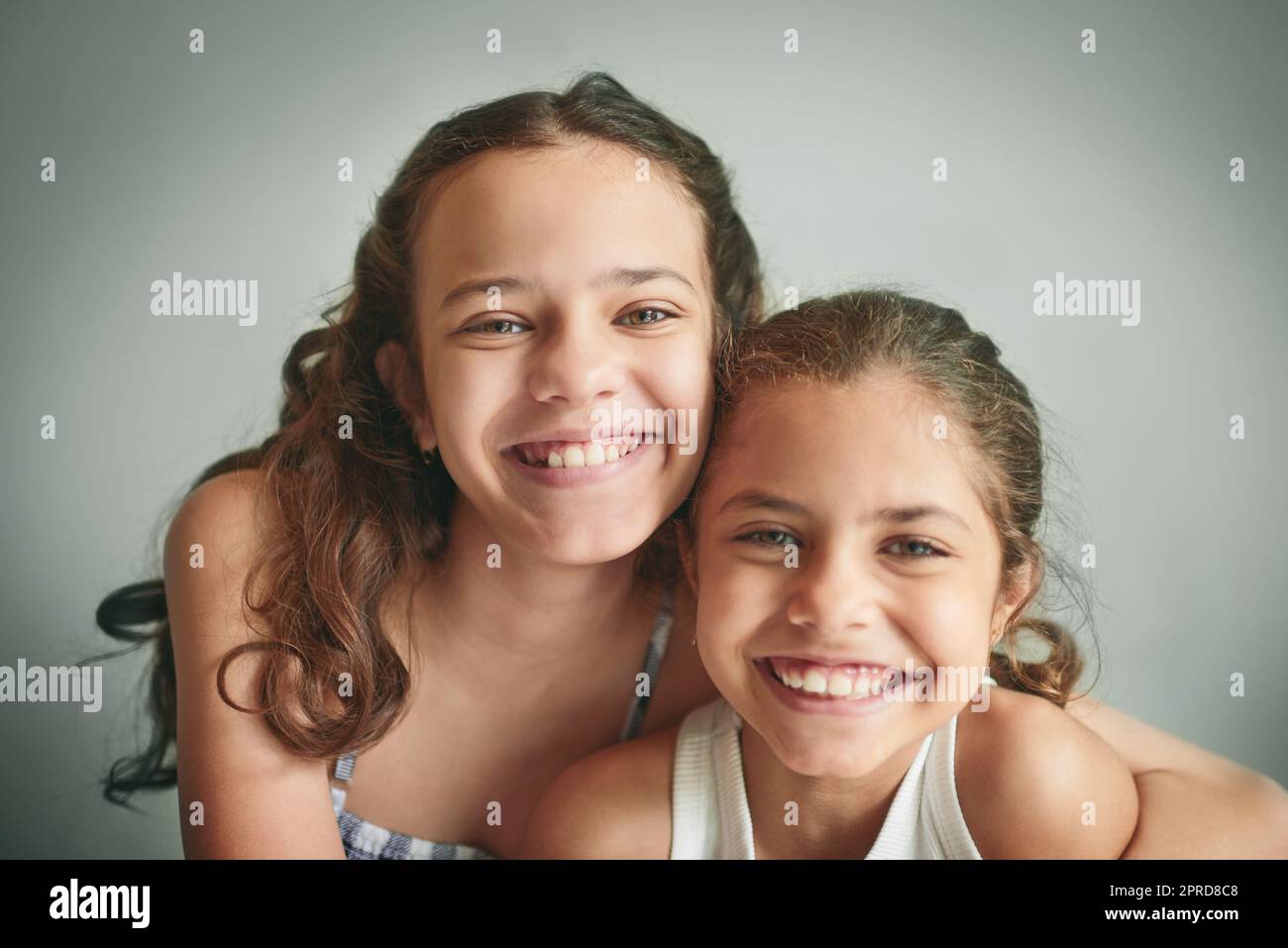 Were sisters and best friends. two young girls spending time together at home. Stock Photo
