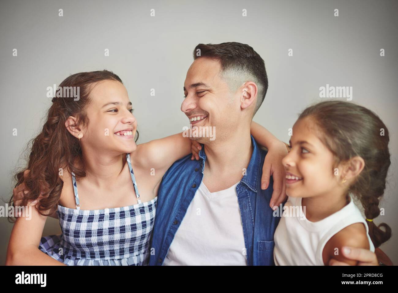 They bring so much joy in to my life. a man spending quality time with his young daughters. Stock Photo