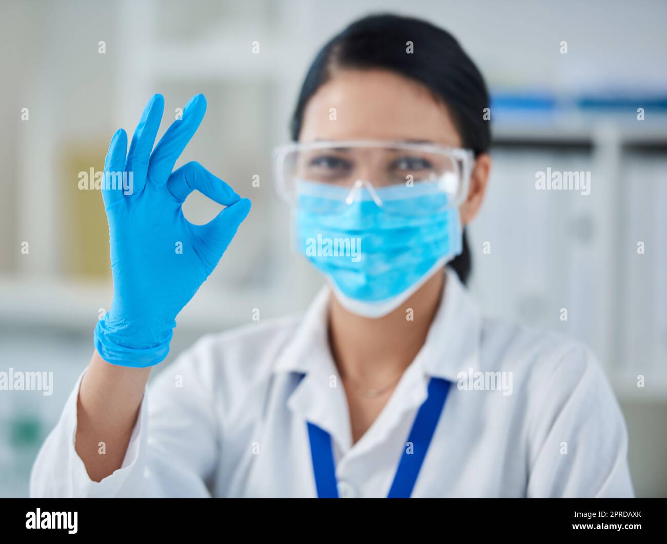Ive made the breakthrough weve been waiting for. Portrait of a confident young woman making an okay gesture in a laboratory. Stock Photo