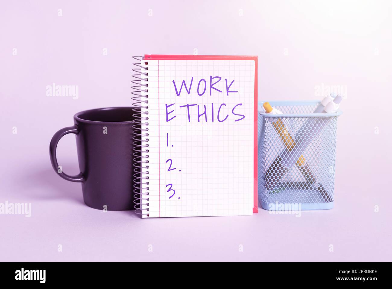 Sign displaying Work Ethics. Business concept A set of values centered on the importance of doing work Cup, Notebook With Important Message And Pencil Case On Desk Stock Photo