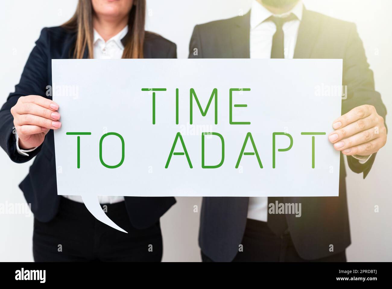Inspiration showing sign Time To Adapt. Business concept Moment to adjust oneself to changes Embrace innovation Business Team Holding Important Information On Speech Bubble On Both Sides. Stock Photo