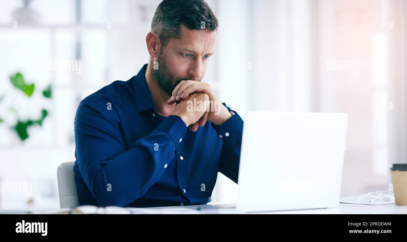 Im all out of options now. a handsome businessman looking very anxious in his office at work. Stock Photo