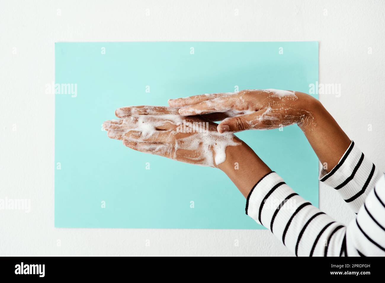 Lather up like your life depends on it. a woman washing her hands with