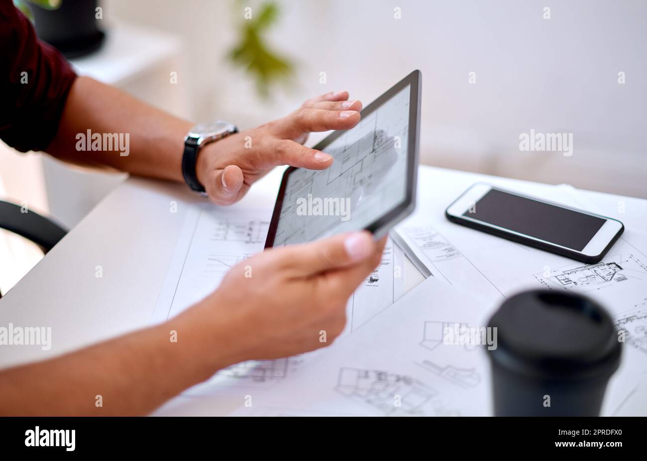 Drafting up something new. Closeup shot of an unrecognisable architect using a digital tablet in an office. Stock Photo