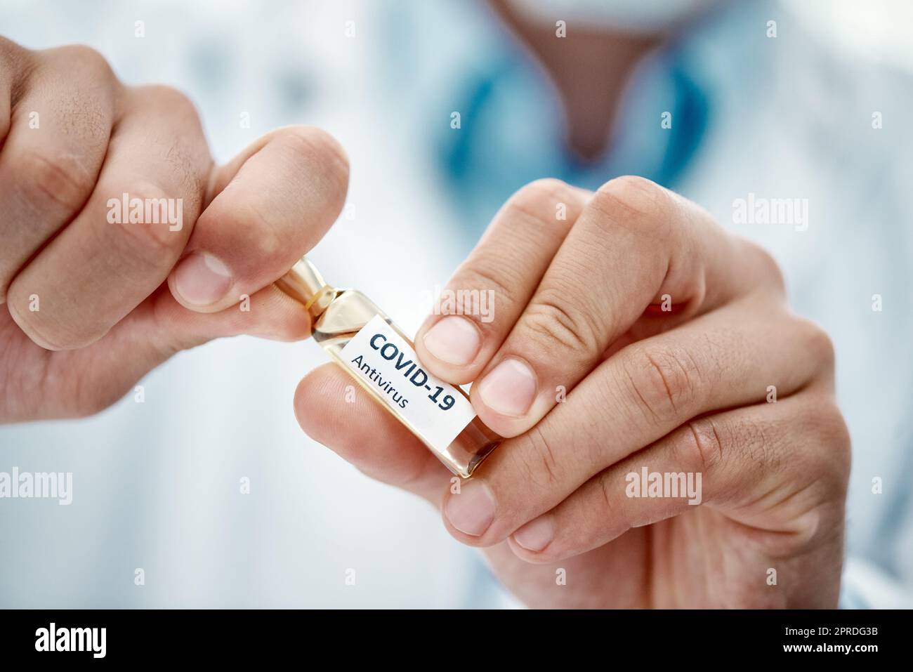 Here to heal the world. a scientist opening an ampoule with 2019-nCov on it. Stock Photo