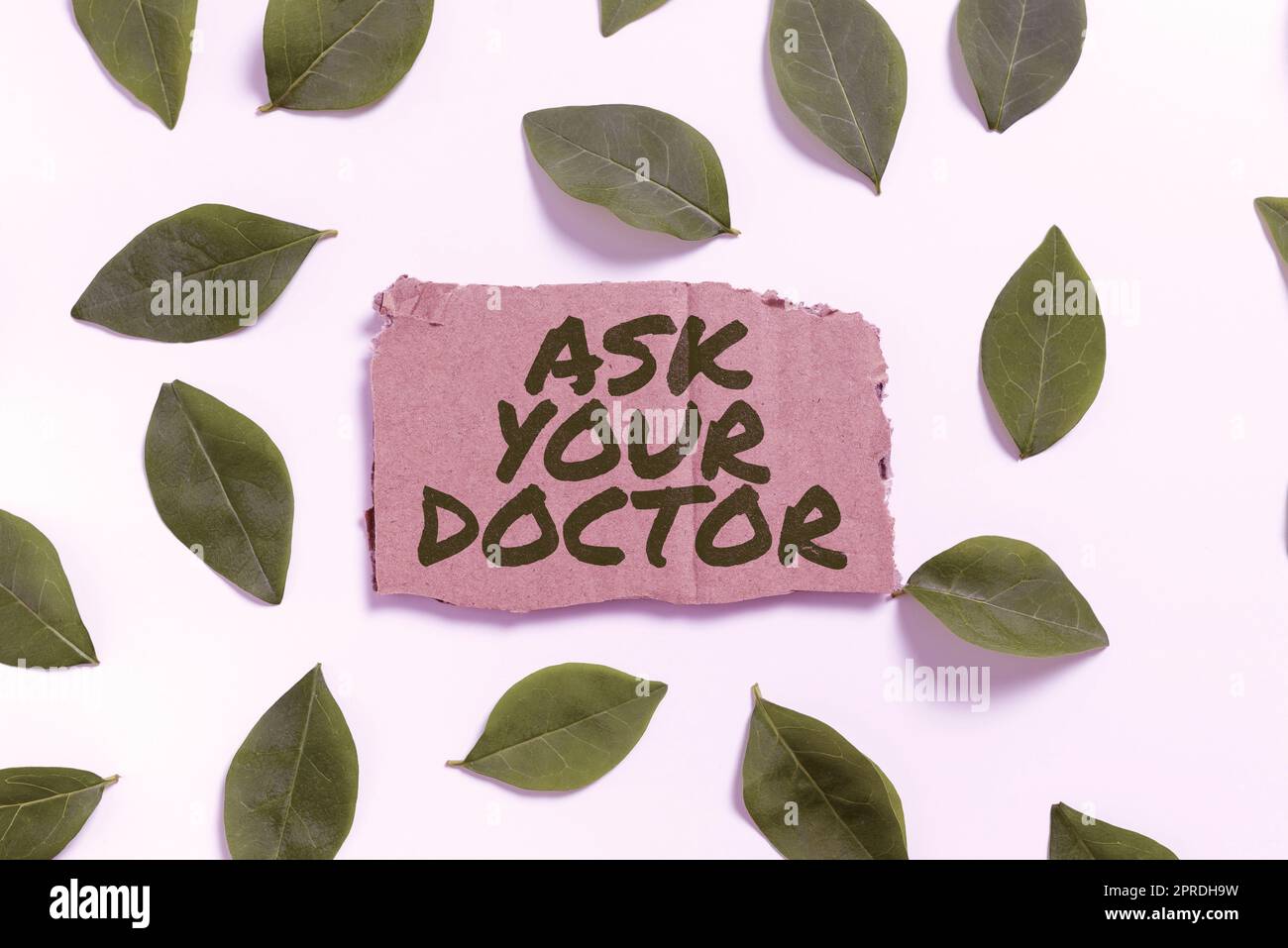 Writing displaying text Ask Your Doctor. Internet Concept Consultation to medical expert about state of health Blank Paper Surrounded With Leaves For Wedding Invitation And Cards. Stock Photo