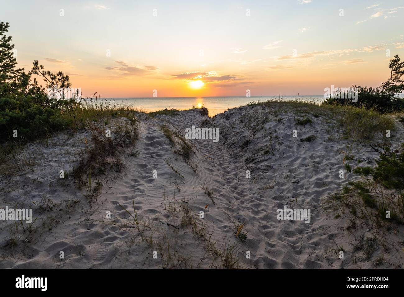 Sunset at the Baltic sea shore. Typical Baltic sea beach landscape Stock Photo