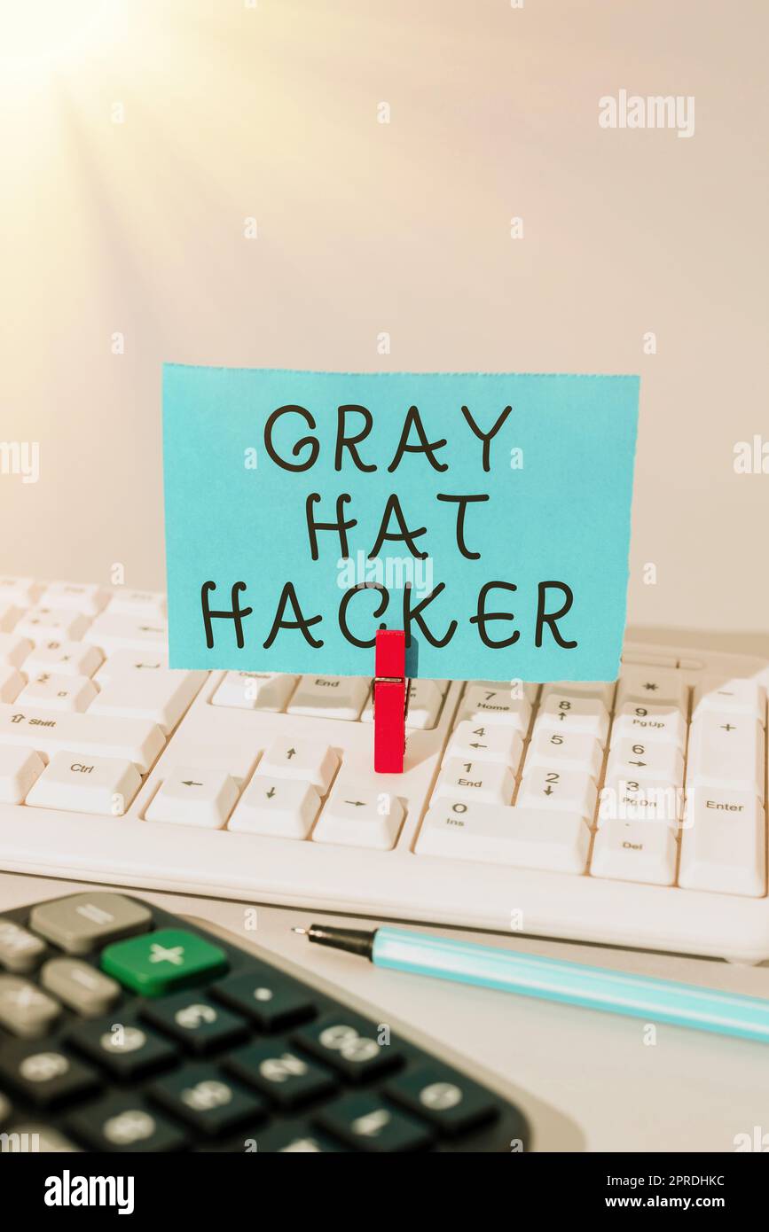 Conceptual caption Gray Hat Hacker. Conceptual photo Computer security expert who may sometimes violate laws Important Message Presented On Piece Of Paper Clipped With Clip. Stock Photo