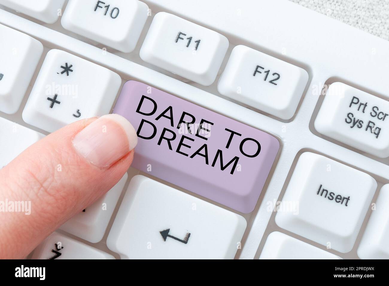 Inspiration showing sign Dare To Dream. Word for Do not be afraid of have great ambitions goals objectives Businesswoman Holding Speech Bubble With Important Messages. Stock Photo
