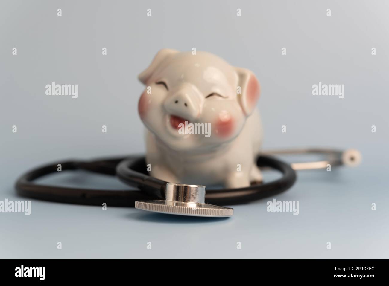 medical stethoscope piggy bank business concept insurance investment health care and saving money. Stock Photo