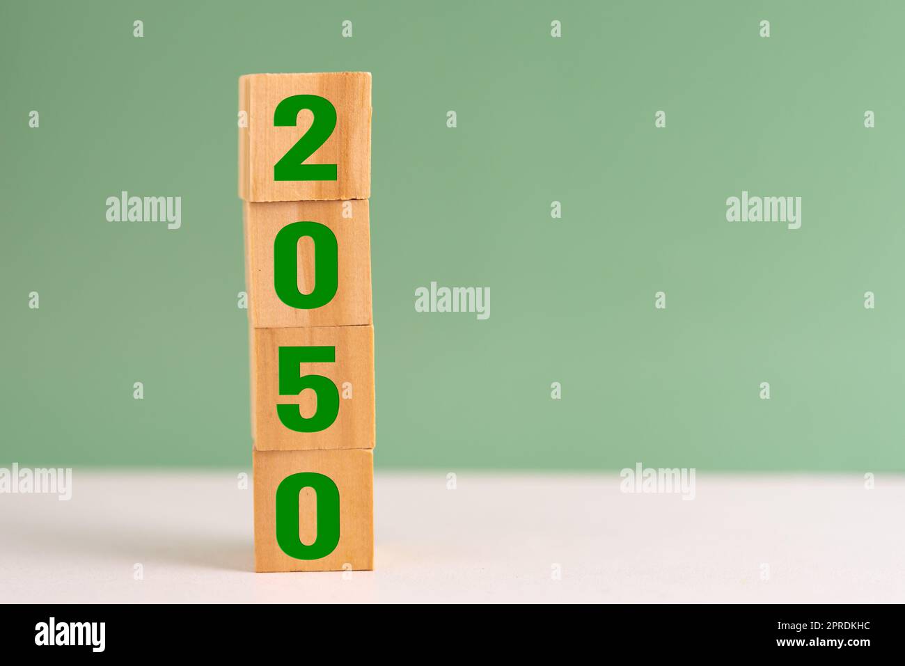 wood cube block net zero target 2050 environmental strategy economy and carbon credit on table background concept. Stock Photo