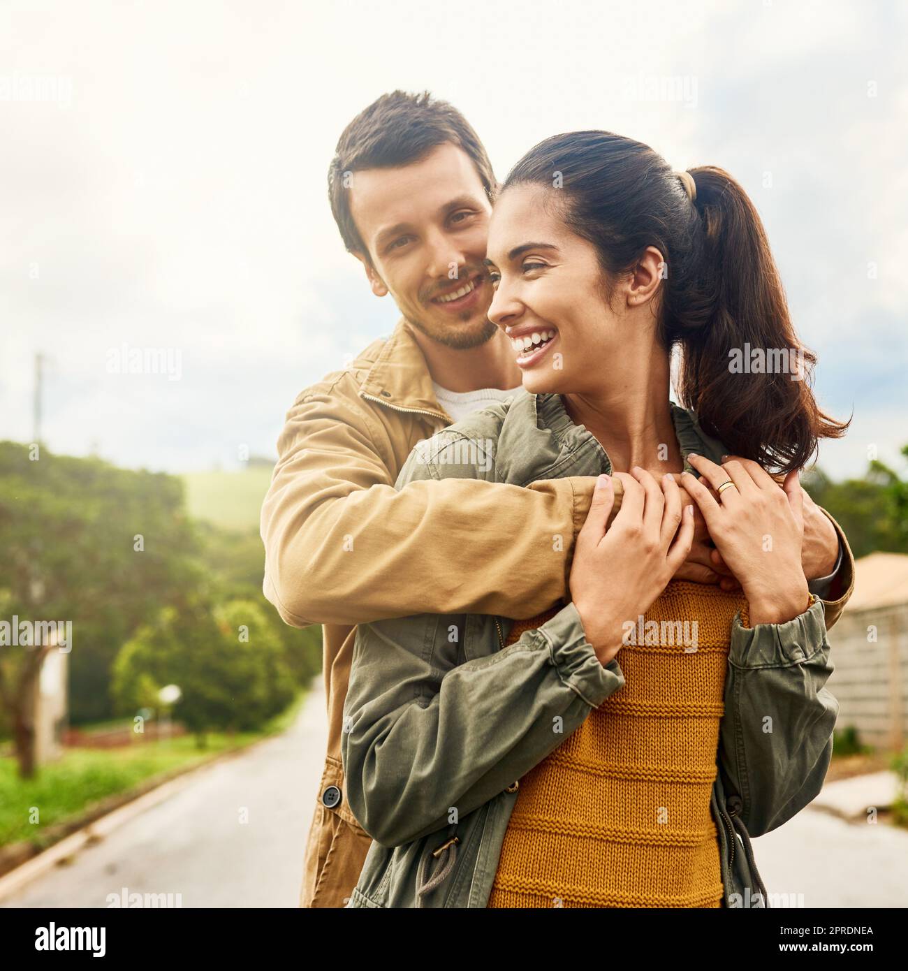 This kinda love will never get old. an affectionate young couple standing outdoors. Stock Photo